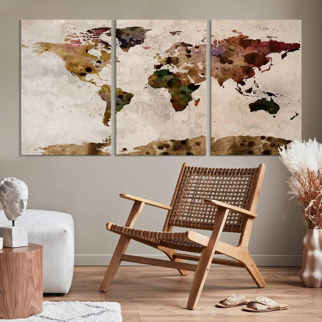 A Watercolor World Map Canvas Print, wrapped in an elegant gallery style, hangs on the wall.