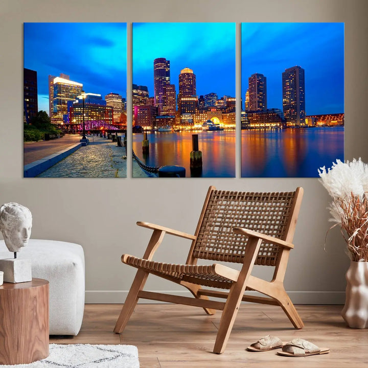 A triptych of the "Boston City Lights Night Blue Skyline Cityscape View Wall Art Canvas Print" adorns the wall. This museum-quality canvas artwork is ready to hang and includes a UV-protective coating for lasting brilliance.