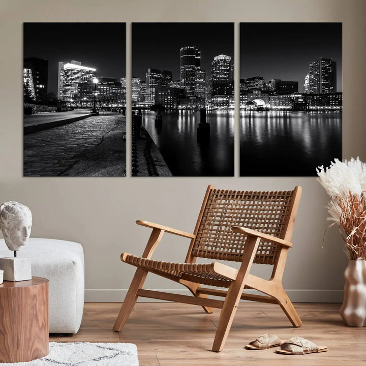 The Boston City Lights Skyline Black and White Wall Art Cityscape Canvas Print portrays a triptych of the city skyline at night reflecting on a calm river. This museum-quality canvas features UV-protective finishes to preserve its timeless allure.