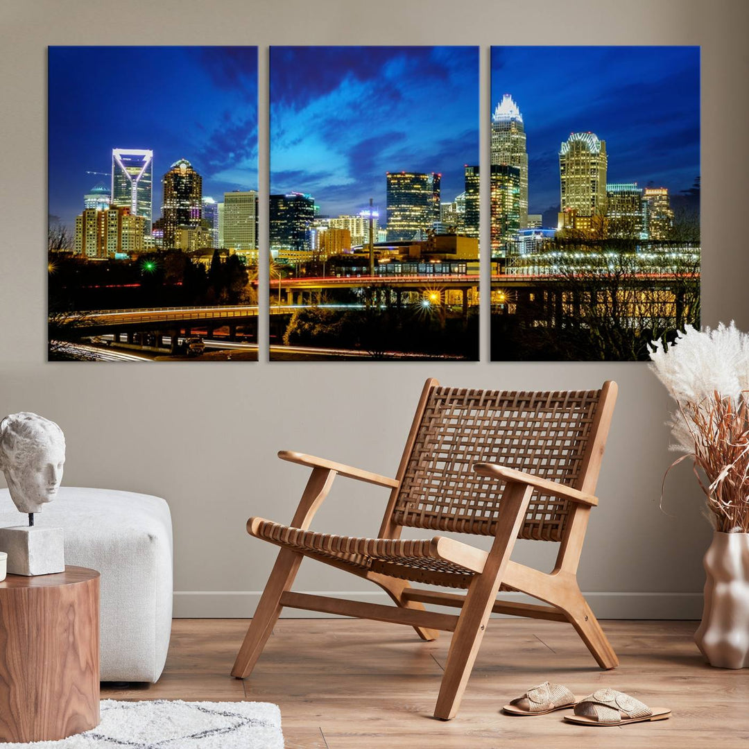 A modern living room highlighted by the "Charlotte City Lights Cloudy Blue Night Skyline Cityscape View" wall art canvas print, crafted on museum-quality canvas with UV-protective coating.