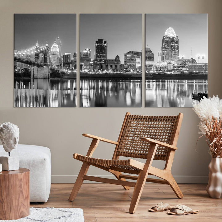 The "Cincinnati City Lights Skyline Black and White Wall Art Cityscape Canvas Print" is elegantly displayed in a stylish living room.