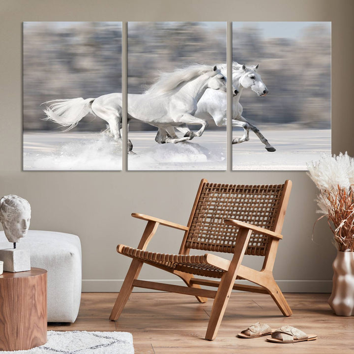 The "All The White Horses Wall Art Canvas Print" depicts a triptych of galloping white horses across a snowy landscape. These museum-quality canvases come with a UV-protective coating to maintain their stunning appearance over time.