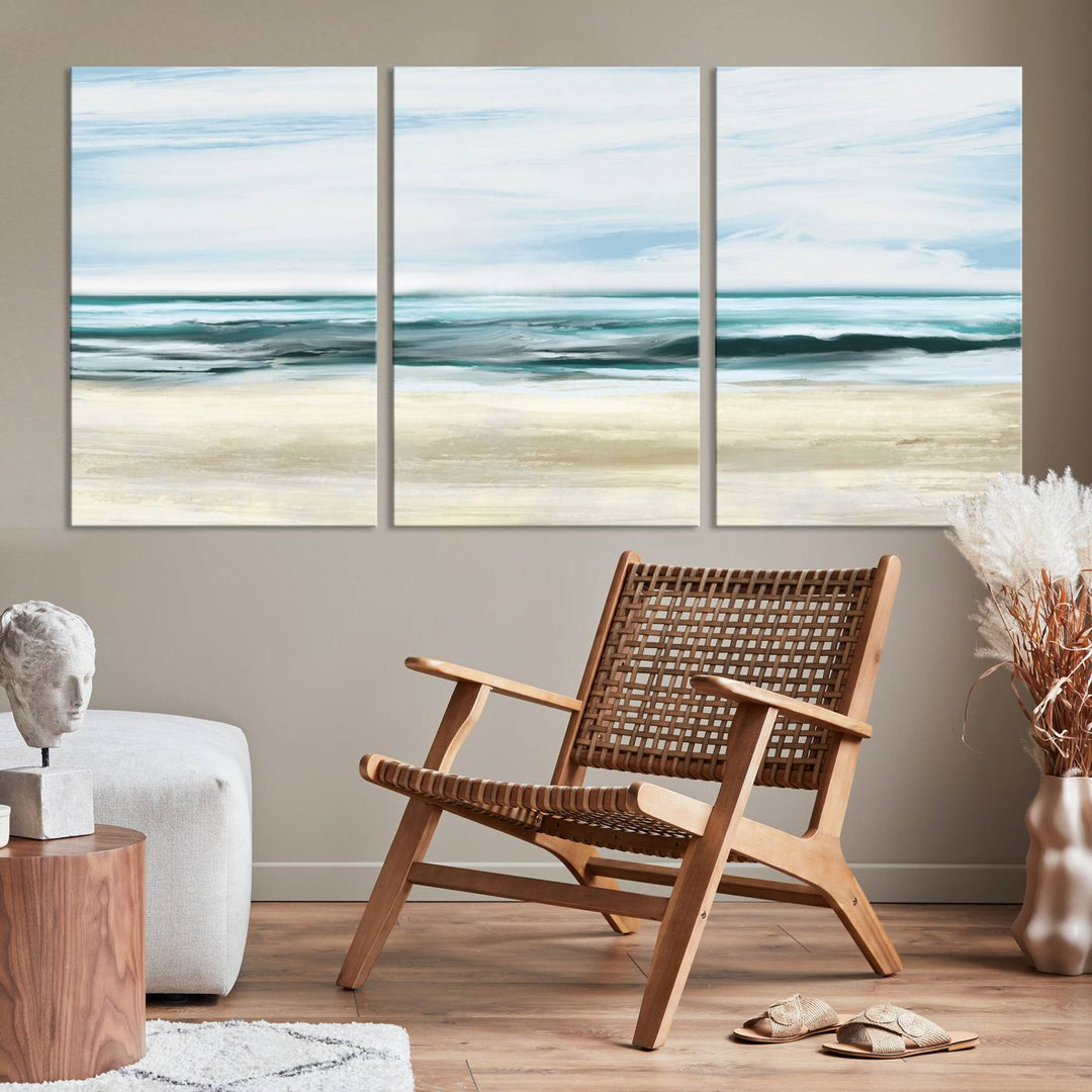 The room features the Ocean Abstract Wall Art Canvas Print, a triptych beach painting on museum-quality canvas with a gallery-wrapped finish and UV-protective coating.