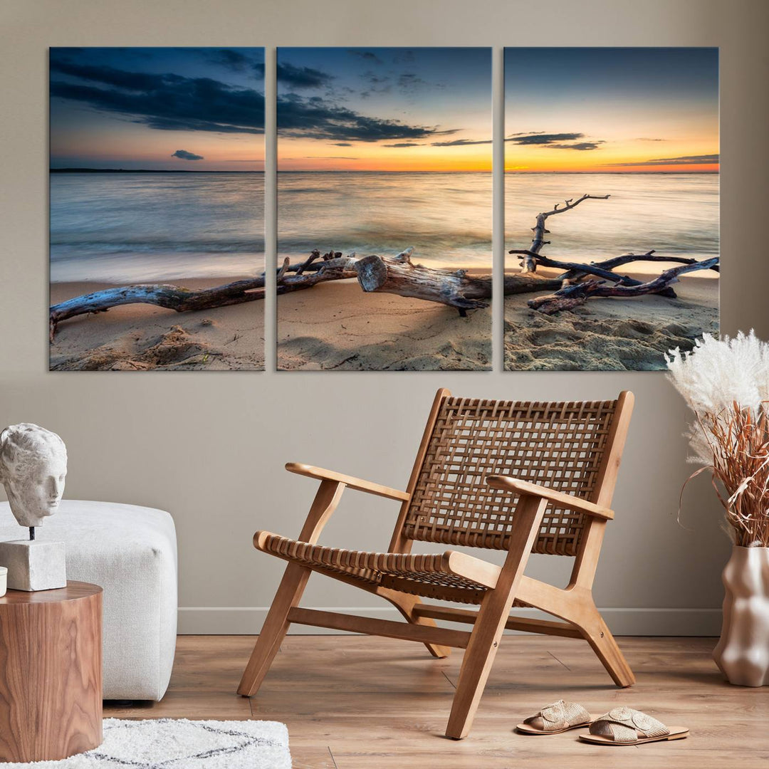 A captivating piece of Ocean Sunset Beach Wall Art Canvas Print, gallery wrapped, graces the gray wall.