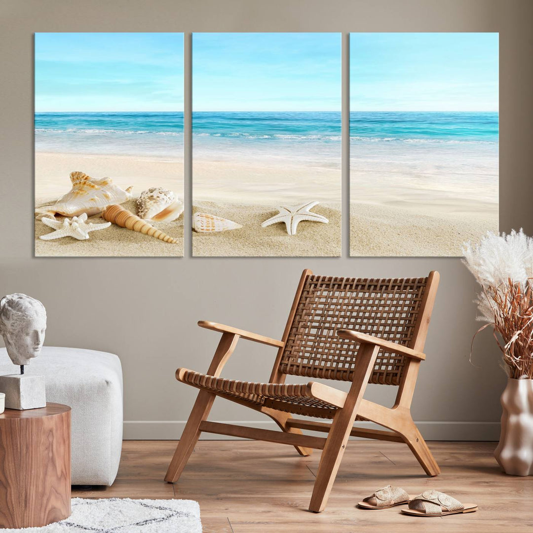 The "Turquoise Ocean View Seashell Starfish on the Beach Canvas Print Artwork" is a triptych piece that showcases a tranquil beach scene, complete with seashells and starfish adorning the sand. It is elegantly gallery-wrapped on museum-quality canvas.