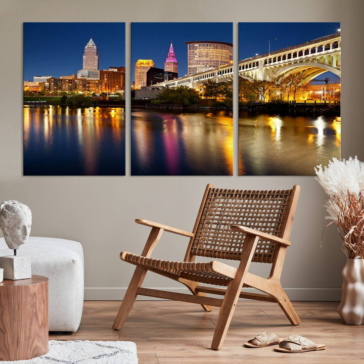 The "Cleveland Night Skyline Wall Art City Cityscape Canvas Print" is a striking feature in the room, showcasing a city skyline with a bridge reflecting in a river. Displayed on museum-quality canvas, it offers enduring beauty.