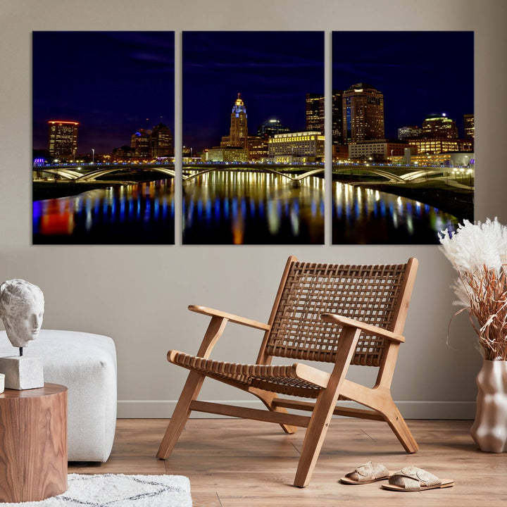 The "Columbus City Lights Night Skyline Cityscape View Wall Art Canvas Print" showcases a stunning city skyline at night, with illuminated buildings and bridges reflecting in the river, on a museum-quality canvas ready to hang.