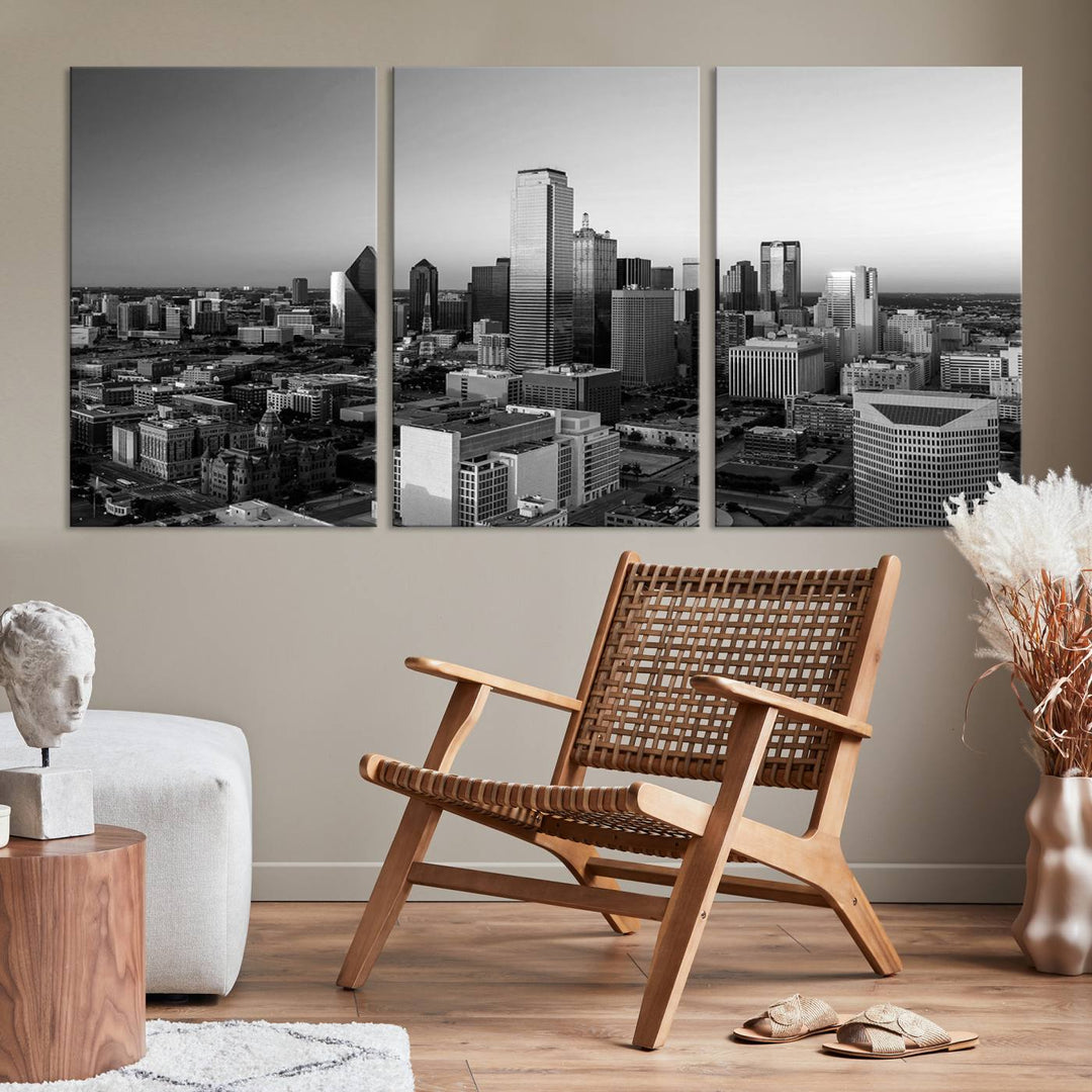 A modern living room showcases the Dallas City Lights Skyline Black and White Wall Art Cityscape Canvas Print. This gallery-wrapped piece offers a sleek finish and is crafted from museum-quality pollycotton. It features a UV-protective coating to ensure lasting vibrancy.