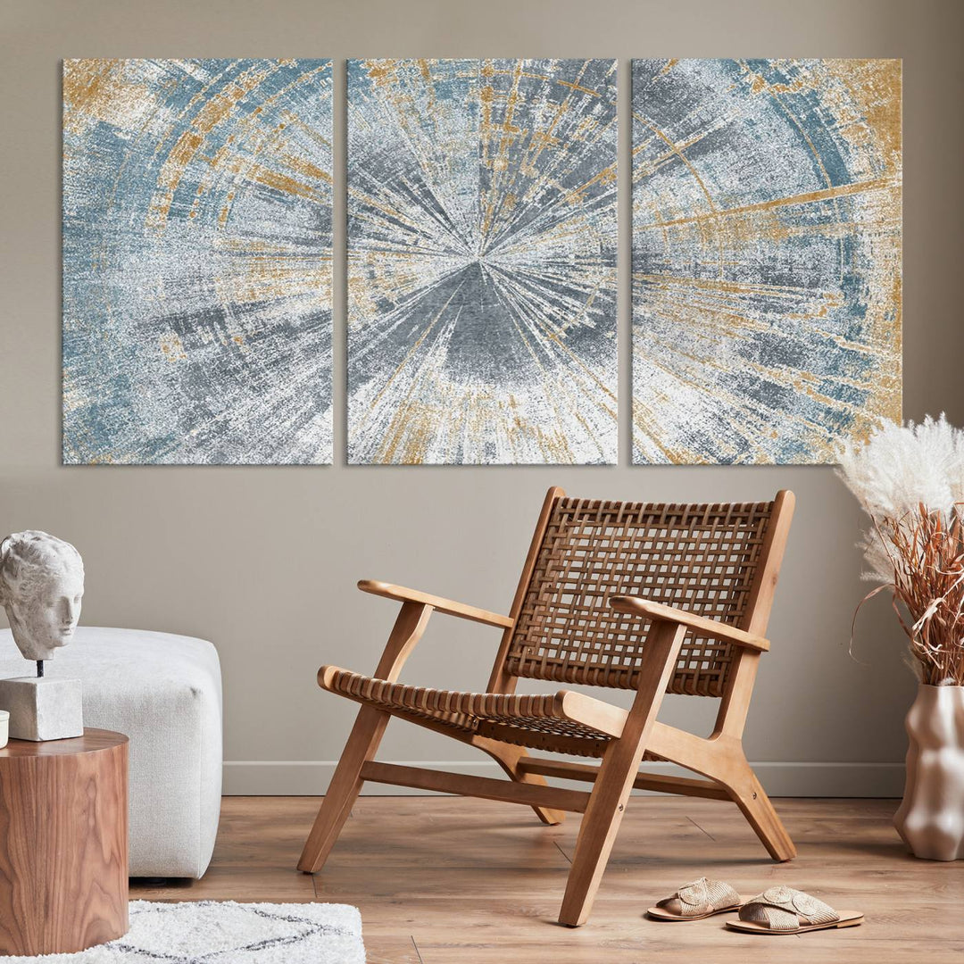 The Radiant Abstract Wood Rings Canvas Art, a modern triptych wall decor, enhances the contemporary style of the living room with its blue, white, and gold hues.