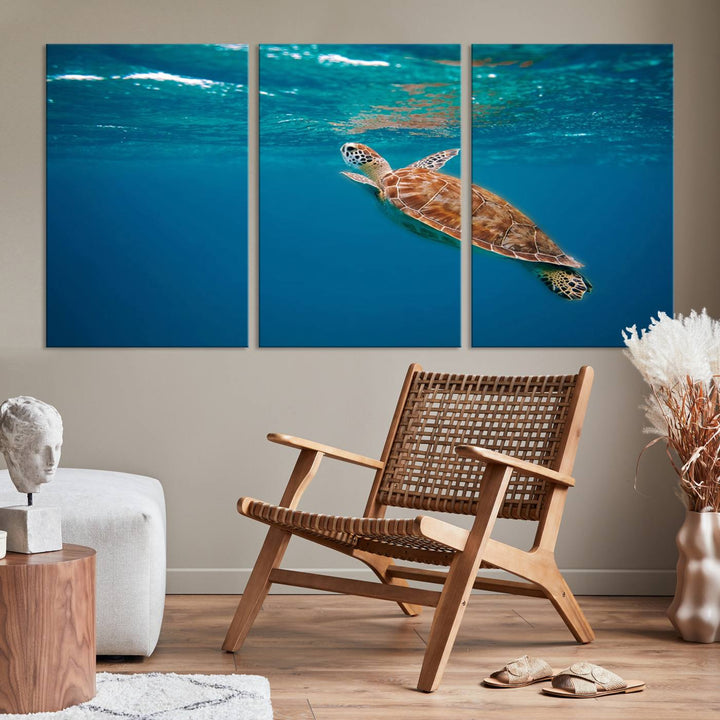 The living room features the "Baby Turtle in Ocean" wall art canvas print. This gallery-quality piece, depicting a sea turtle swimming underwater, adds an elegant touch to the space.