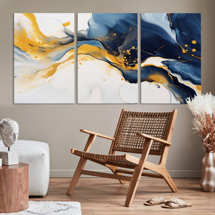 The Blue and Gold Abstract Fluid Canvas Art, with its swirling patterns, adorns the wall. This modern wall art beautifully complements the contemporary interior decor, adding an elegant touch with its rich blue, gold, and white tones.