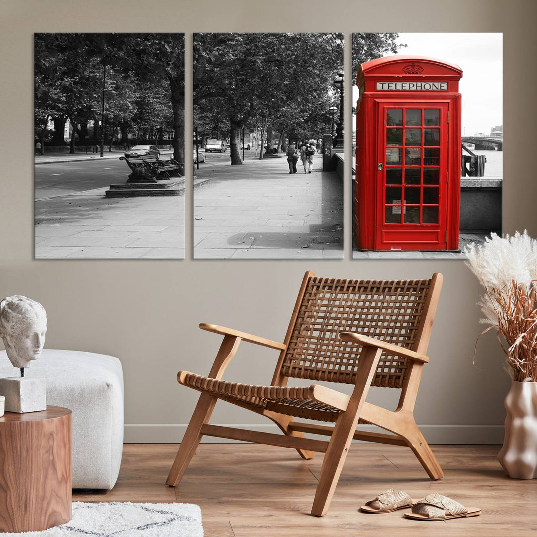 The London Phone Club Wall Art is a stunning piece that showcases a red telephone box set in a black and white street scene on museum-quality canvas. It is gallery wrapped with a UV-protective coating to preserve its vibrant charm.