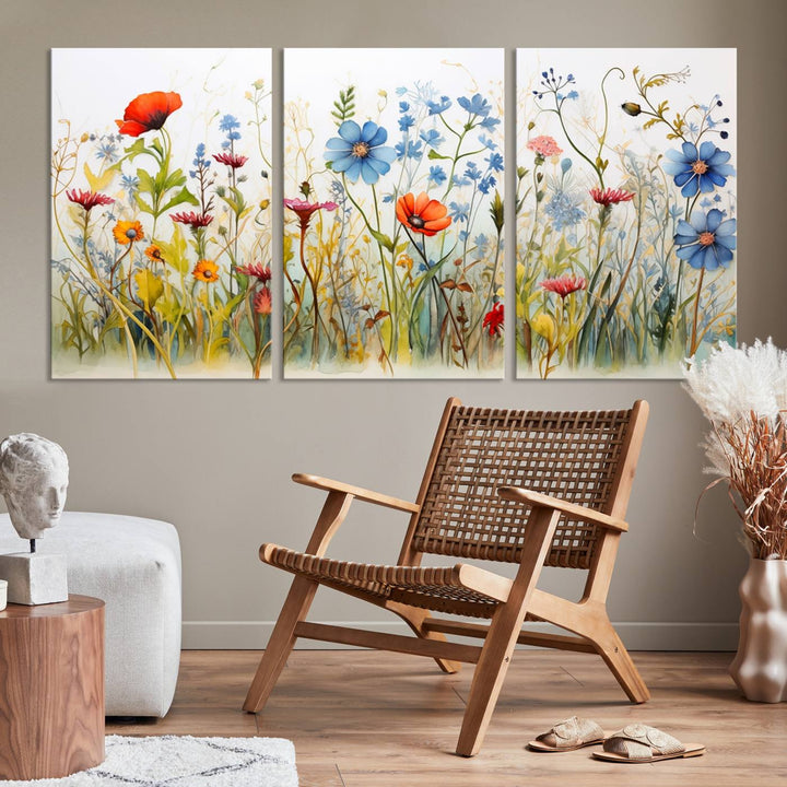 The Colorful Wildflower Canvas Wall Art – Vibrant Floral Botanical Print, consisting of a large 3 panel set, adds bright nature decor to the living room against a black wall.