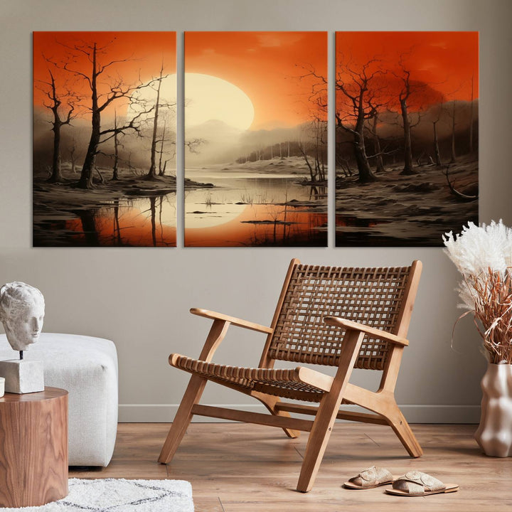 The "Abstract Watercolor Trees and Sunset on Lake Wall Art" is a triptych masterpiece, showcasing an orange-hued landscape of barren trees and a large sun. Displayed on museum-quality canvases with UV-protective coating, it creates a striking visual element in any space.