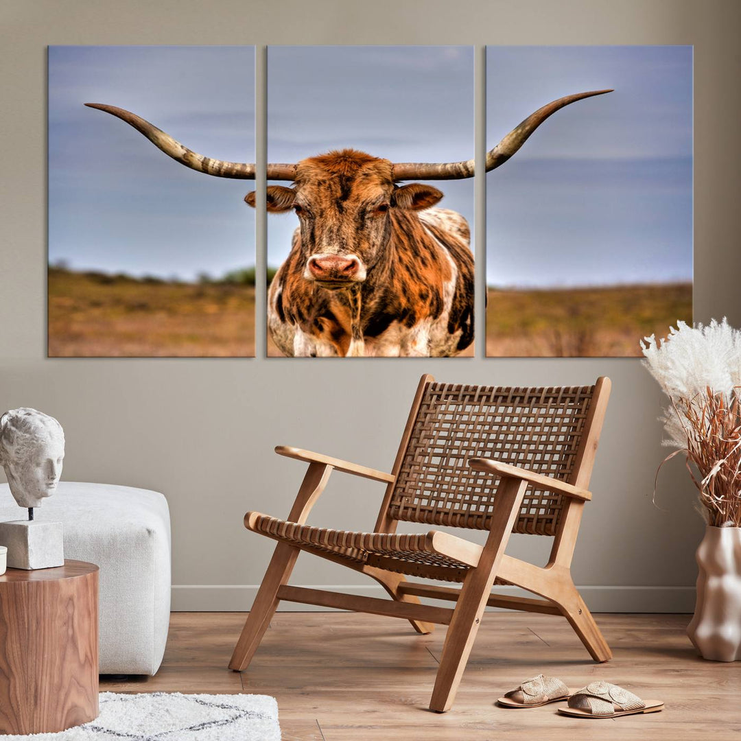 The Texas Longhorn Wall Art Print, a triptych canvas artwork depicting a longhorn bull in a field, features a gallery-quality finish.