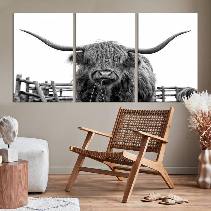 The Longhorn Canvas Print, featuring a black-and-white triptych of a Bighorn cow with shaggy fur and impressive long horns, is elegantly showcased. This wall art piece boasts a gallery-quality finish on premium canvas, bringing sophistication to any room.