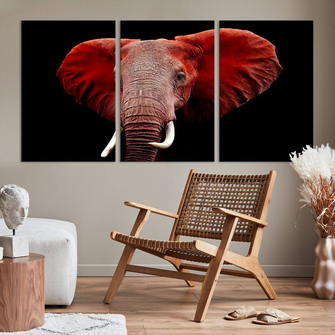 A Wall Art Canvas Print in the modern living room features a three-panel premium design of a red elephant face.