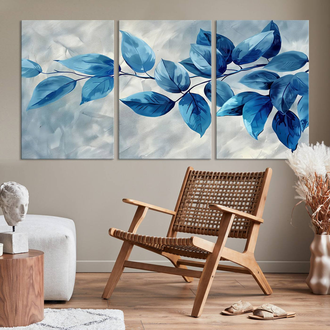 A Blue Leaf Abstract Wall Art Canvas Print, featuring a textured background and gallery-quality finish, is displayed.