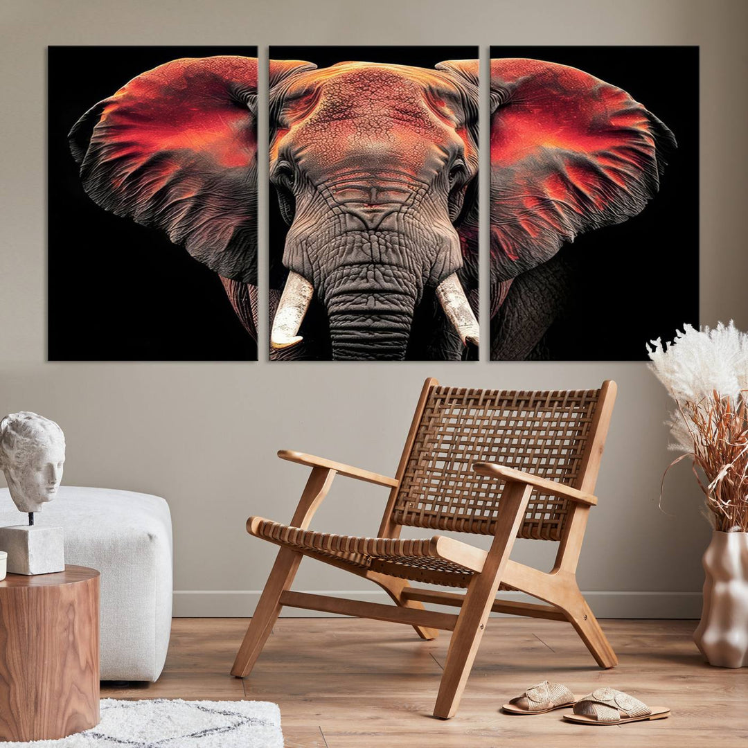 The Elephant Wall Art Canvas Print, featuring vibrant red and black tones, is a stunning artwork printed on museum-quality canvas. It comes with a UV-protective coating.