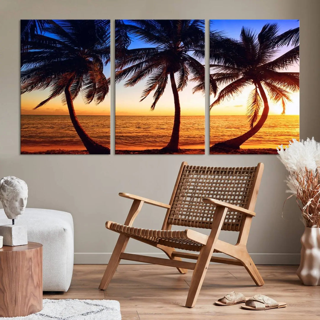 The living room features a wall adorned with the "Wall Art Canvas Curve Palms at Sunset on Beach," showcasing gallery-wrapped, museum-quality canvases in a stunning triptych.