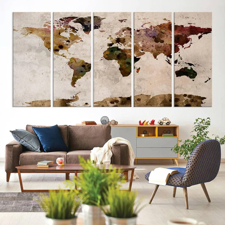 A Watercolor World Map Canvas Print, wrapped in an elegant gallery style, hangs on the wall.