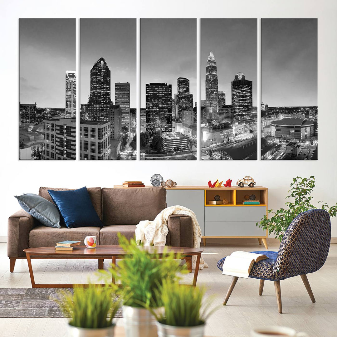 The "Charlotte City Cloudy Skyline Black and White Wall Art Cityscape Canvas Print" hangs on a dark wall, showcasing its UV-protective properties for enduring beauty.