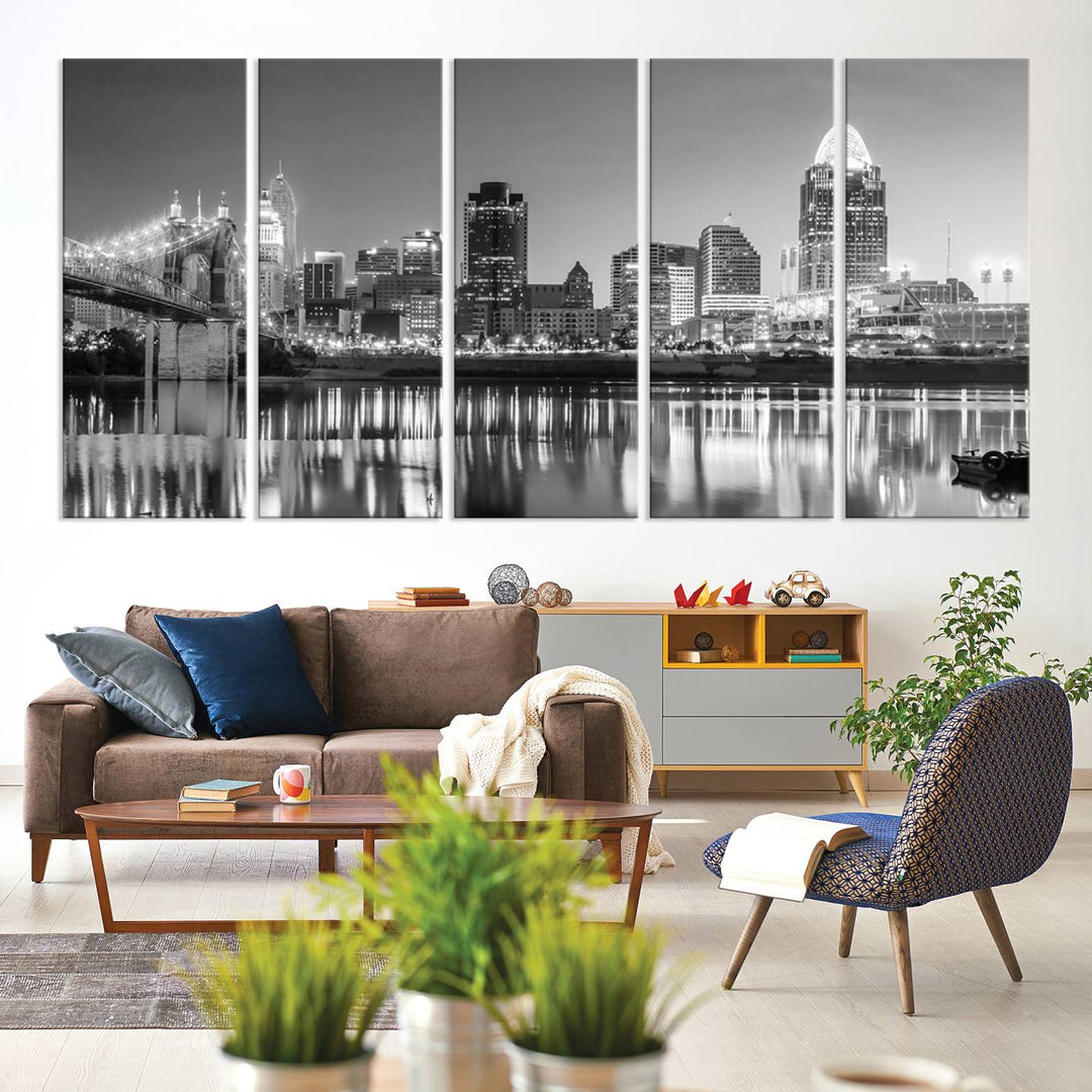 The "Cincinnati City Lights Skyline Black and White Wall Art Cityscape Canvas Print" is elegantly displayed in a stylish living room.