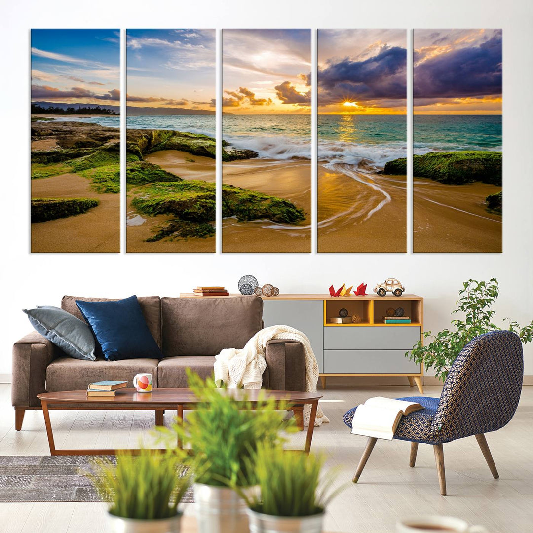 The Sunset Beach Wall Art Canvas Print is a gallery-wrapped triptych showcasing a beach scene with mossy rocks and a vibrant sunset. Made from museum-quality canvas and featuring a UV-protective coating, it elegantly provides both beauty and durability.