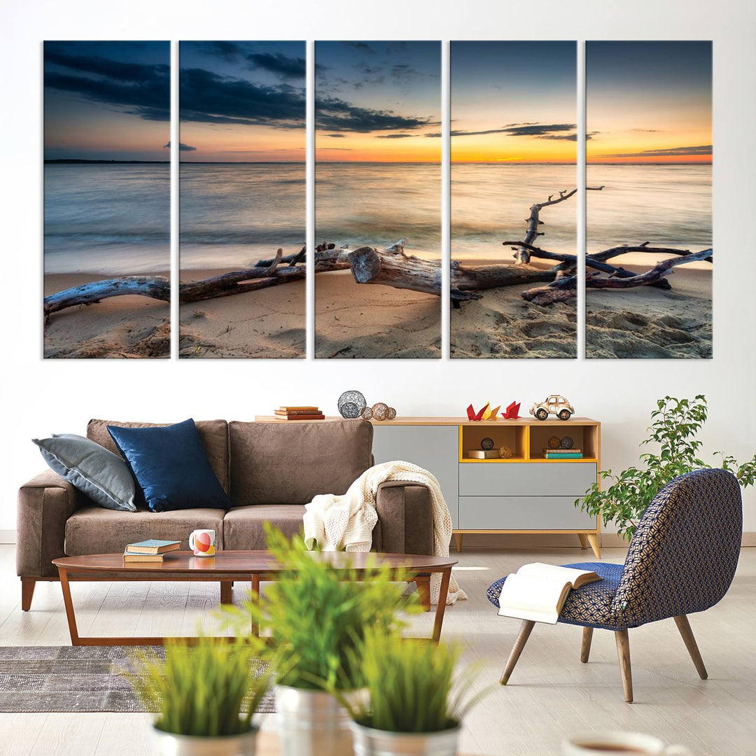 A captivating piece of Ocean Sunset Beach Wall Art Canvas Print, gallery wrapped, graces the gray wall.