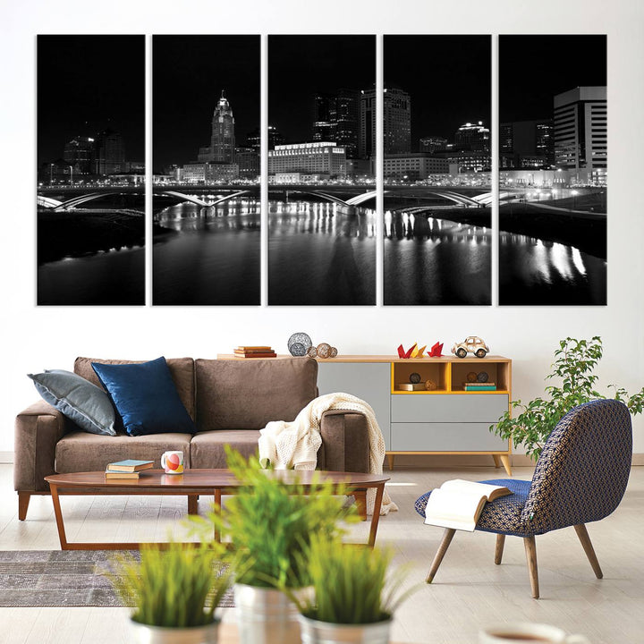 The living room features the "Columbus City Lights Skyline Black and White Wall Art Cityscape Canvas Print" above a coffee table. This artwork is presented as a triptych on museum-quality canvases with UV-protective coating.