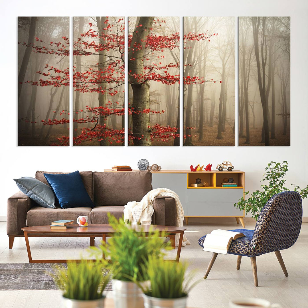 The living room features the Foggy Forest Wall Art, an Autumn Trees Canvas Print that showcases a serene nature scene with foggy woodland decor and a tree adorned in vibrant red leaves.