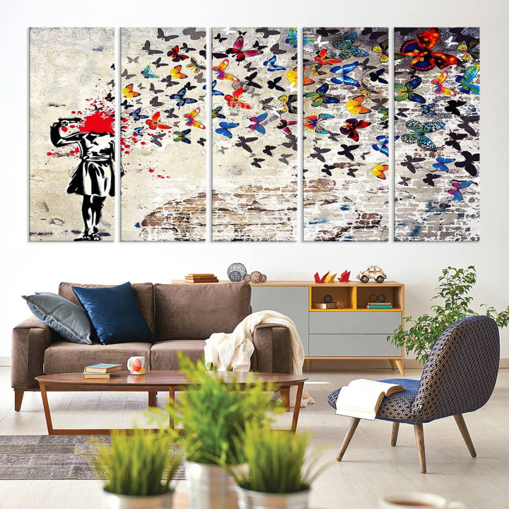 The Banksy Art Butterfly Girl Explosion Canvas showcases a dynamic figure with butterflies bursting from their head, set against a textured wall background. This vibrant urban graffiti piece is perfect for modern interiors and comes ready to hang.