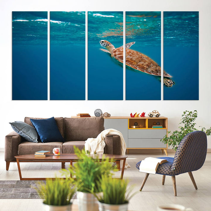 The living room features the "Baby Turtle in Ocean" wall art canvas print. This gallery-quality piece, depicting a sea turtle swimming underwater, adds an elegant touch to the space.