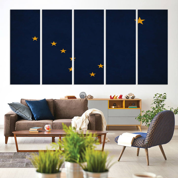 A contemporary living room featuring a triptych artwork of stars on a navy background, accentuated by the striking Alaska States Flag Wall Art Canvas Print.