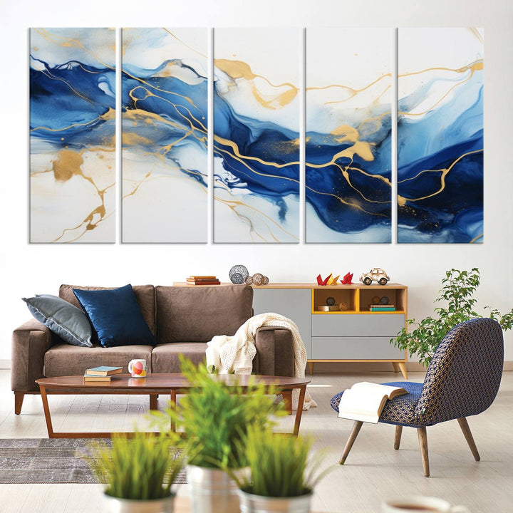 The Blue Abstract Wall Art is displayed as a triptych on museum-quality canvas, showcasing a blue and gold abstract design. The artwork includes a UV-protective coating to maintain its vibrancy and comes with the benefit of free shipping.