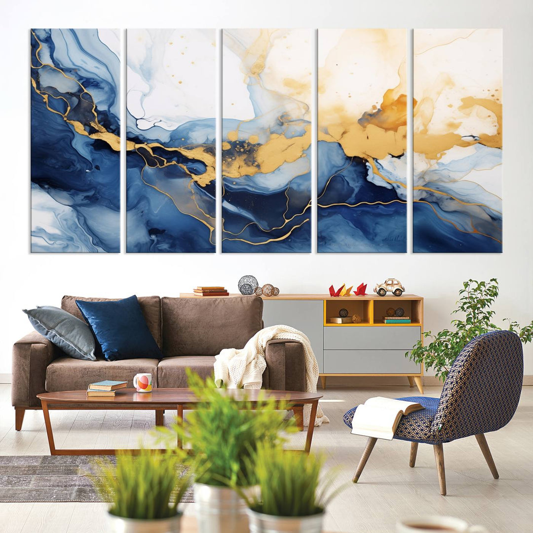 A contemporary living room featuring the "Navy Blue Gold Abstract Wall Art Canvas Print" on the wall, displayed on a gallery-wrapped, museum-quality canvas.