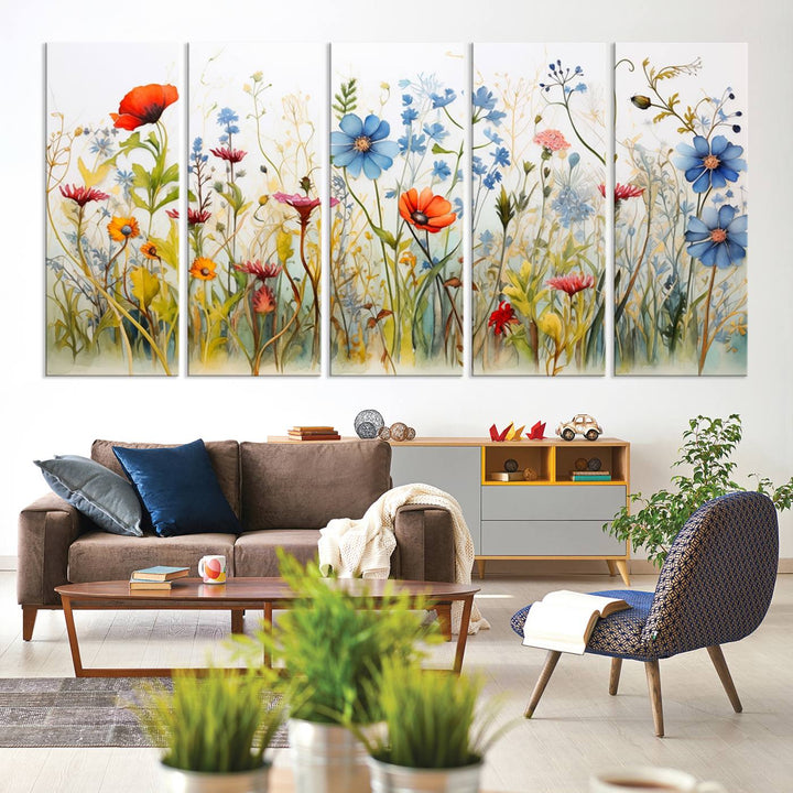 The Colorful Wildflower Canvas Wall Art – Vibrant Floral Botanical Print, consisting of a large 3 panel set, adds bright nature decor to the living room against a black wall.