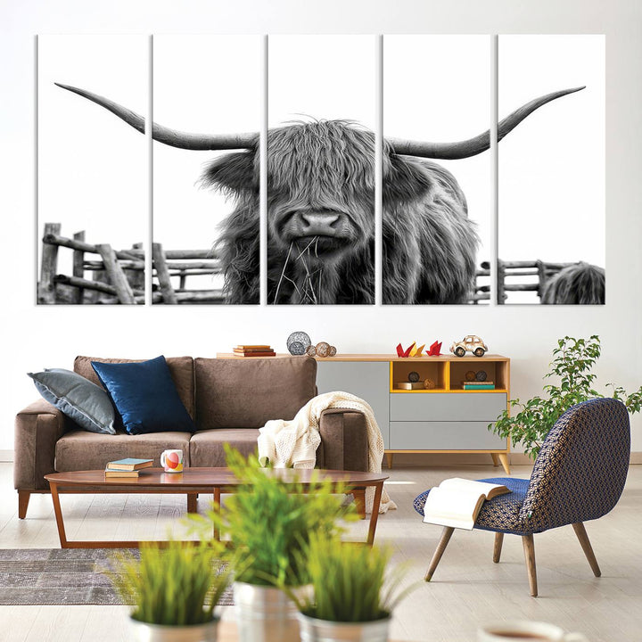 The Longhorn Canvas Print, featuring a black-and-white triptych of a Bighorn cow with shaggy fur and impressive long horns, is elegantly showcased. This wall art piece boasts a gallery-quality finish on premium canvas, bringing sophistication to any room.