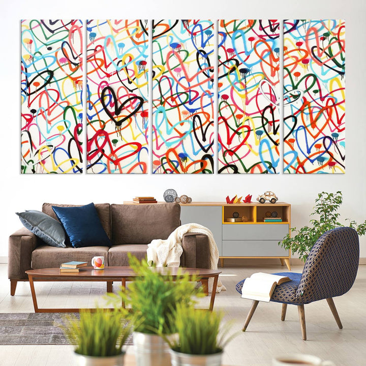 The Colorful Graffiti Love Canvas Print, a street art masterpiece with vibrant abstract swirls and a gallery-quality finish, hangs prominently on the wall.