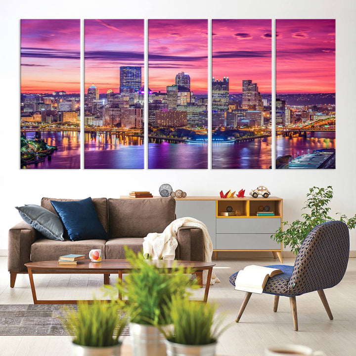 The Pittsburg Wall Art Canvas Print, showcasing a vibrant sunset glow over the city skyline and crafted by a professional artisan, adorns the space.