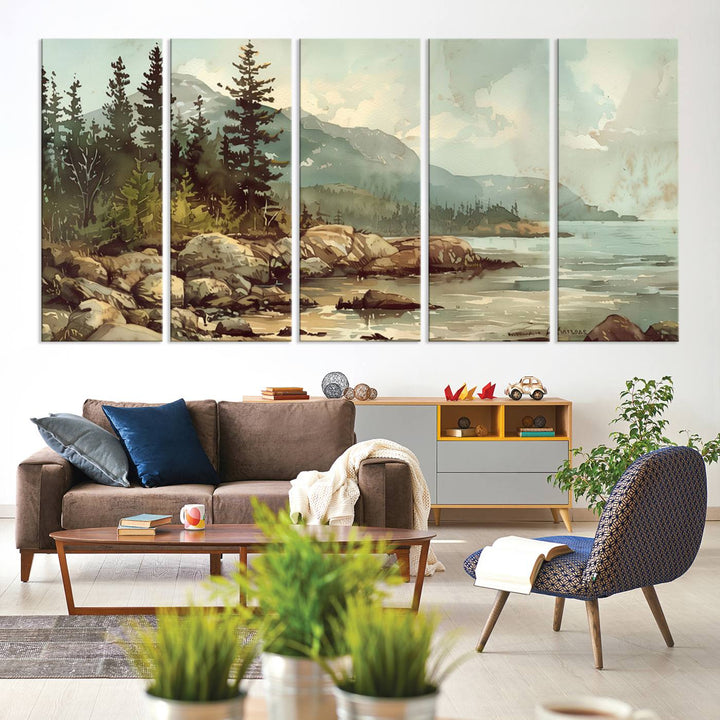 The living room features a breathtaking three-panel Abstract Acadia National Park Wall Art Canvas Print, which beautifully captures the rocky Maine coastline with trees and mountains.