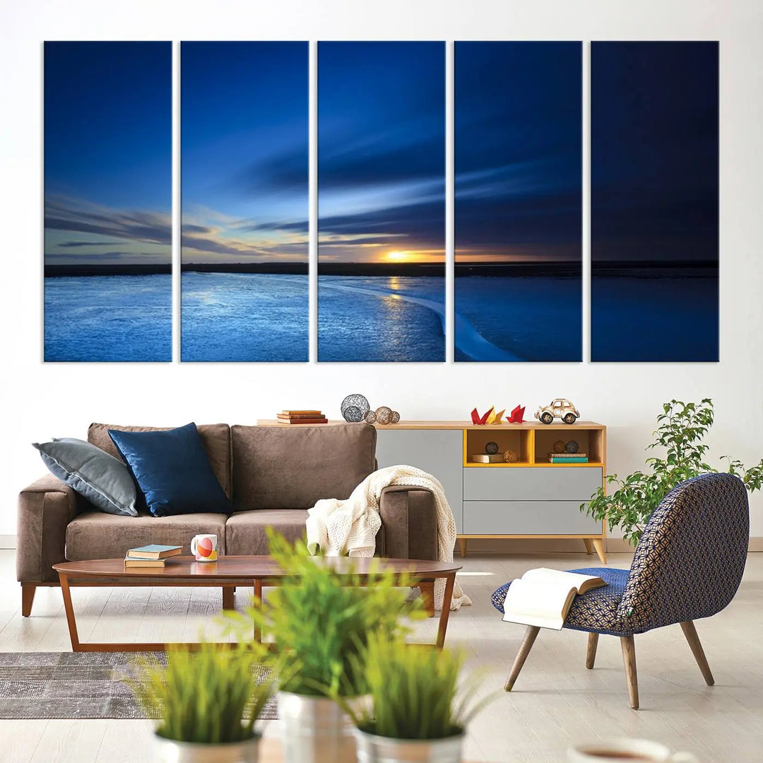 The living room features a triptych of the Wall Art Canvas Print Navy Sunset Lake Landscape Artwork, adding to its tranquil vibe.