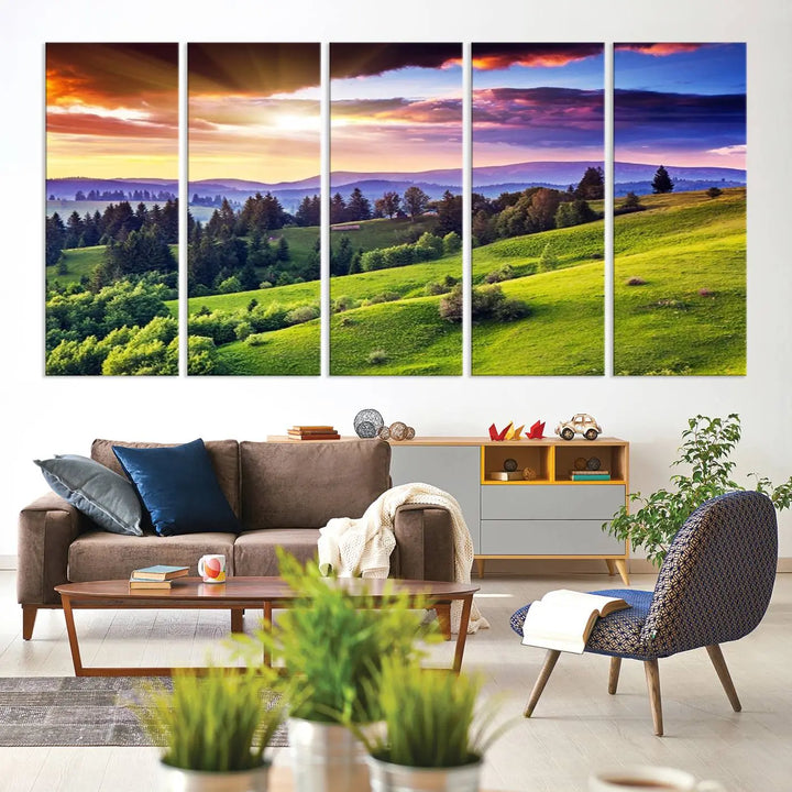 The room features a large triptych of the Green Hills and Sunset Wall Art Print, showcasing a scenic landscape with lush greenery and a vibrant sky.