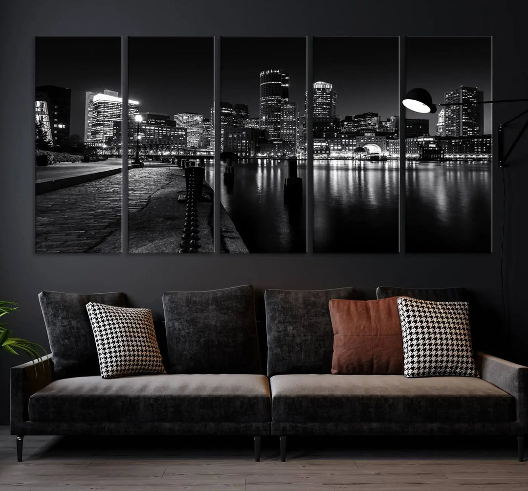 The Boston City Lights Skyline Black and White Wall Art Cityscape Canvas Print portrays a triptych of the city skyline at night reflecting on a calm river. This museum-quality canvas features UV-protective finishes to preserve its timeless allure.