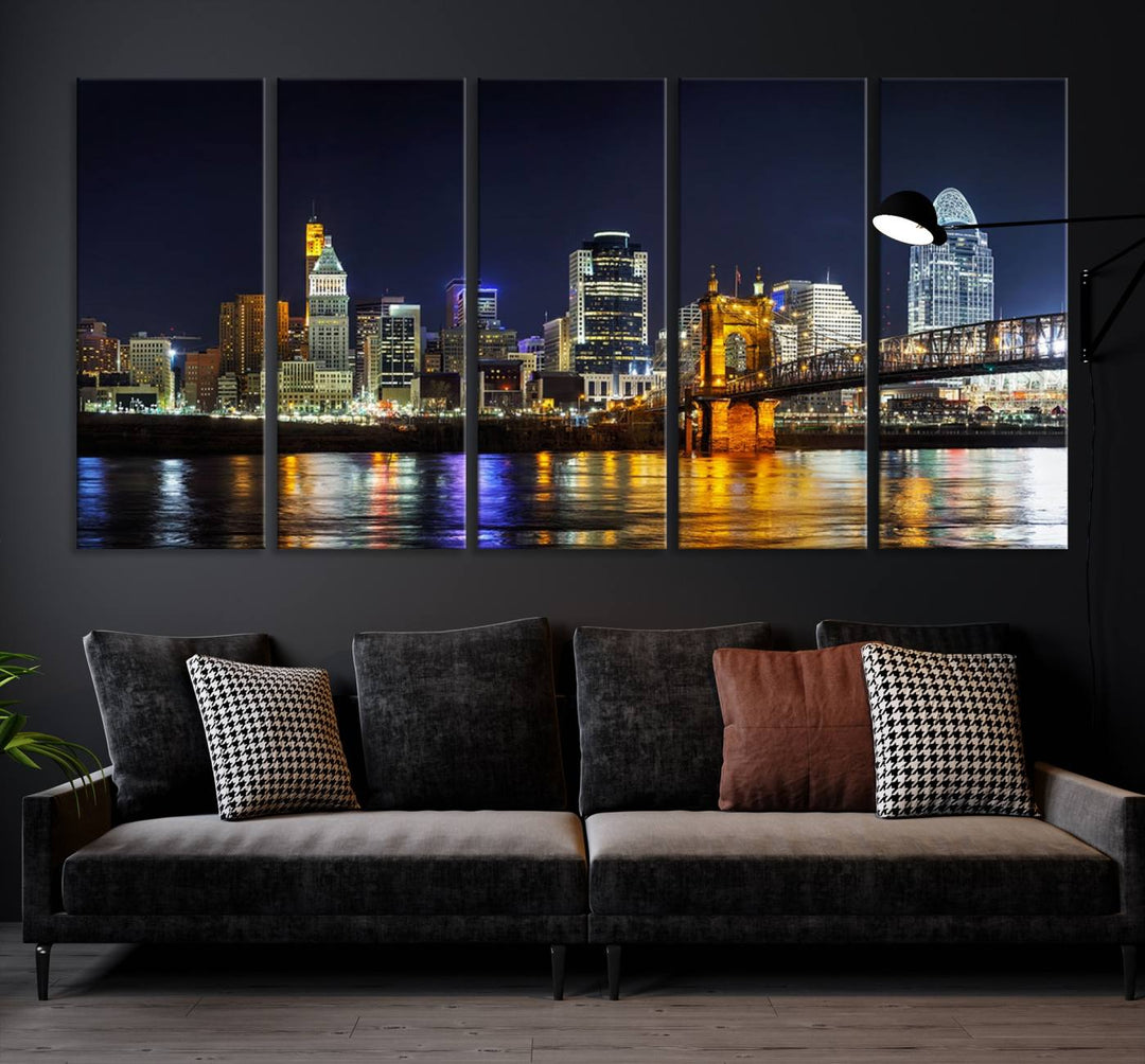 The Cincinnati City Lights Night Skyline Cityscape View Wall Art Canvas Print, crafted on museum-quality canvas with UV-protective coating and ready to hang, adds a touch of sophistication to the wall.