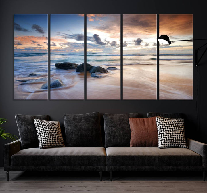 The "Serene Weather On The Beach Wall Art Canvas Print," featuring a tranquil beach scene with rocks and waves, is ready to hang and enjoy.