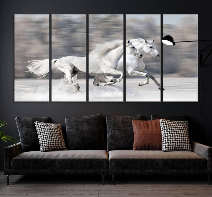 The "All The White Horses Wall Art Canvas Print" depicts a triptych of galloping white horses across a snowy landscape. These museum-quality canvases come with a UV-protective coating to maintain their stunning appearance over time.