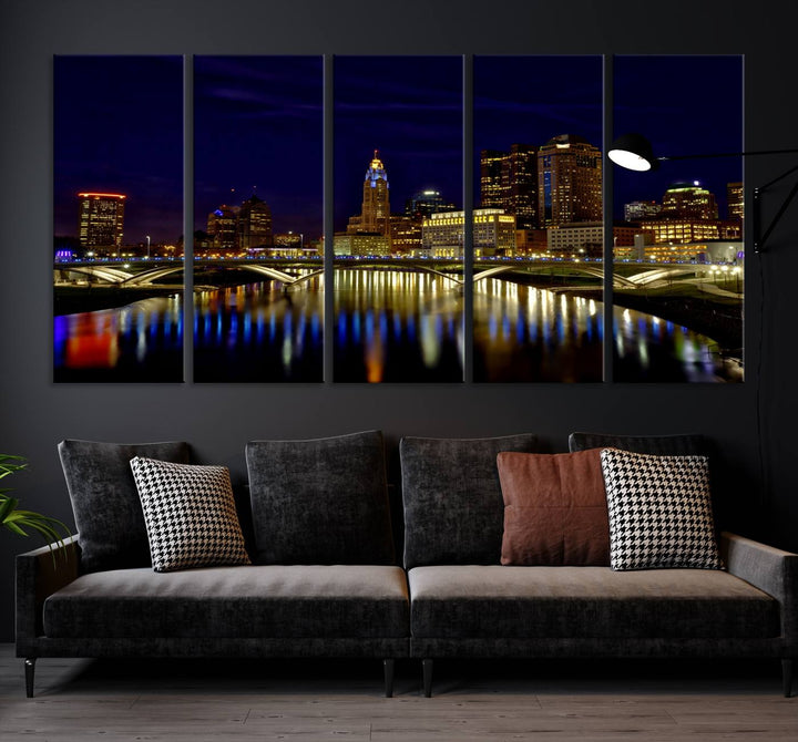 The "Columbus City Lights Night Skyline Cityscape View Wall Art Canvas Print" showcases a stunning city skyline at night, with illuminated buildings and bridges reflecting in the river, on a museum-quality canvas ready to hang.