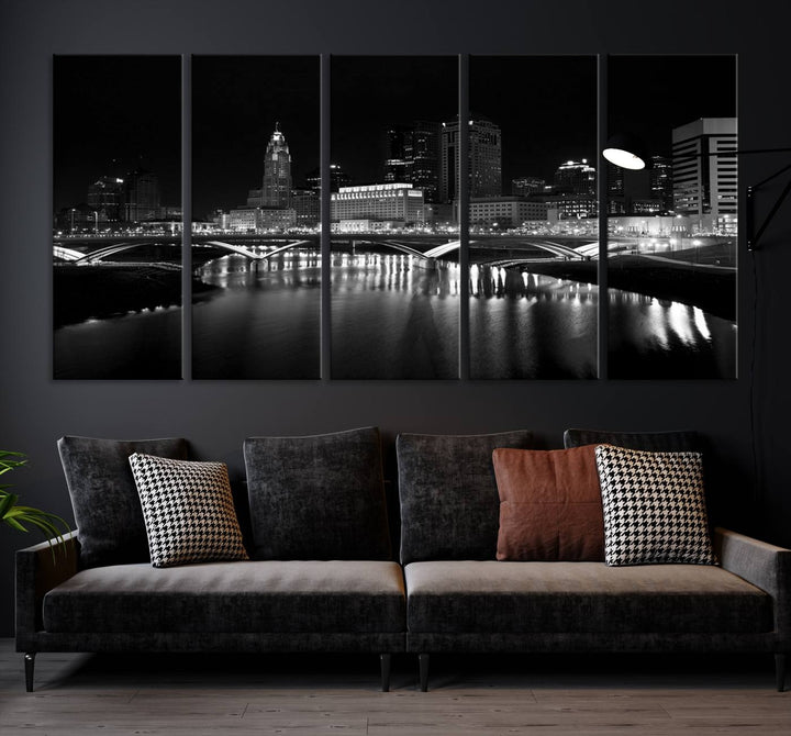 The living room features the "Columbus City Lights Skyline Black and White Wall Art Cityscape Canvas Print" above a coffee table. This artwork is presented as a triptych on museum-quality canvases with UV-protective coating.