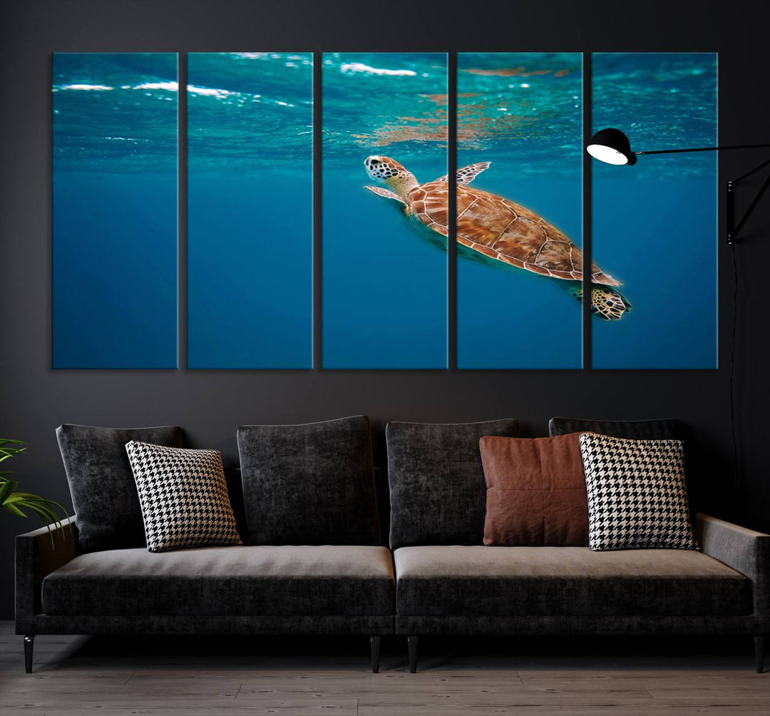 The living room features the "Baby Turtle in Ocean" wall art canvas print. This gallery-quality piece, depicting a sea turtle swimming underwater, adds an elegant touch to the space.